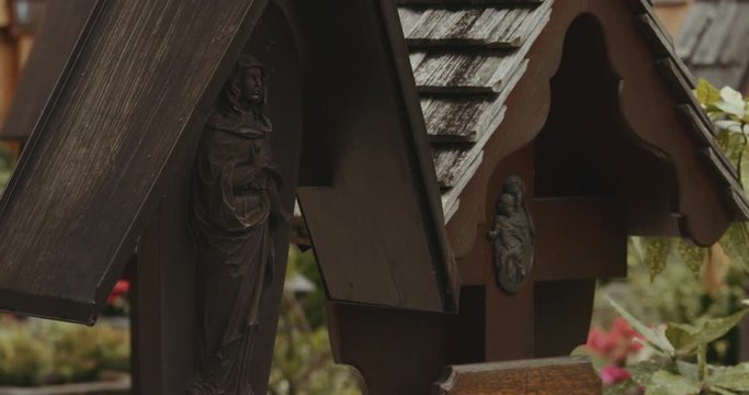Close up cadre of the wooden memorial tablets in the cemetery of a Catholic Church in Hallstatt. Austria.