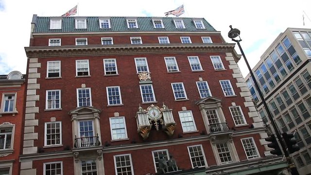 Beautiful Wall Clock On A red Brick Building In London