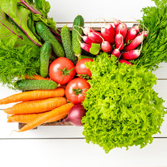 Mix of vegetables on wooden background. Top view