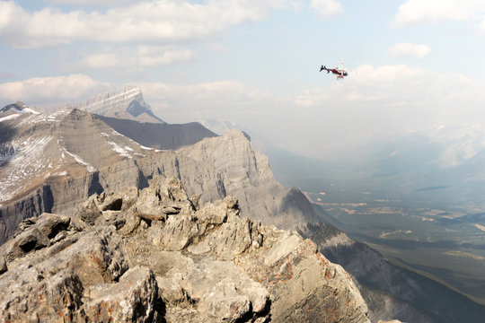 Helicopter Flying Over Mountain