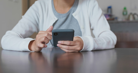 Woman use of smart phone at home