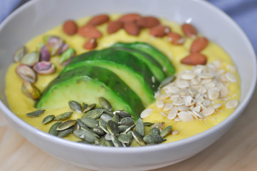 smoothie bowl, mango yogurt with avocado topping
