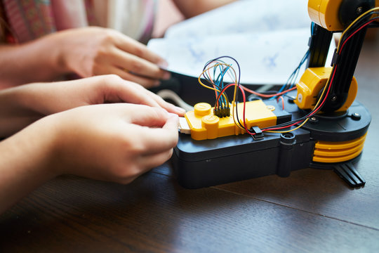 Students assembling a robotics kit