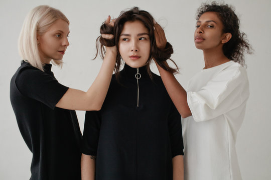 Multiethnic models posing with hair