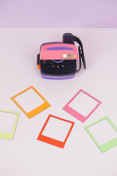 Polaroid camera on pink background