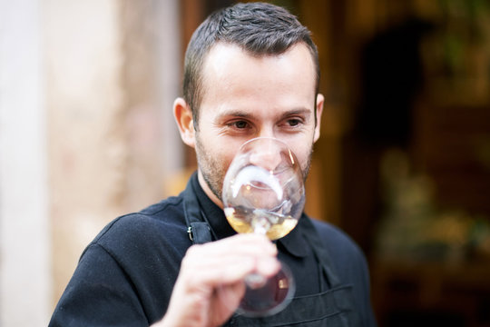 Sommelier smelling a white wine