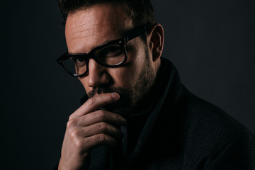 Handsome man over dark background.