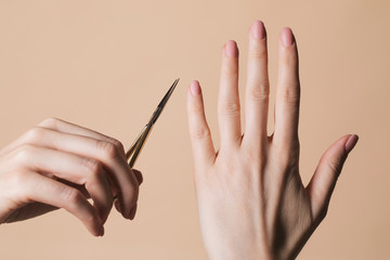 Woman Holding Nail Scissors