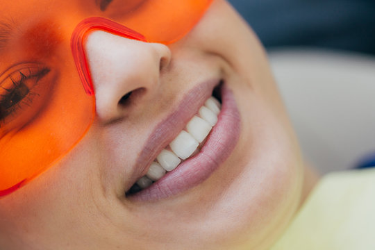 Patient with protective glasses looking at camera