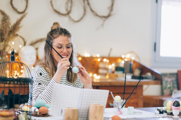 Woman preparing easter in the workshop