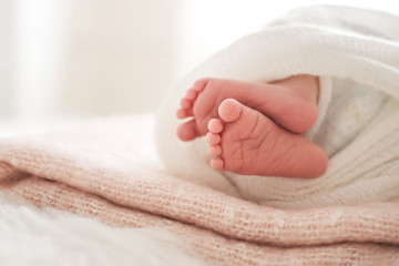 Little feet of a newborn baby