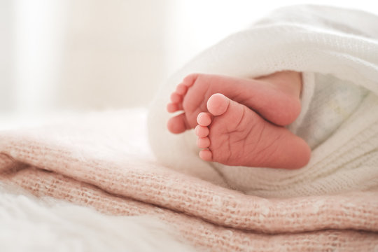 Little feet of a newborn baby