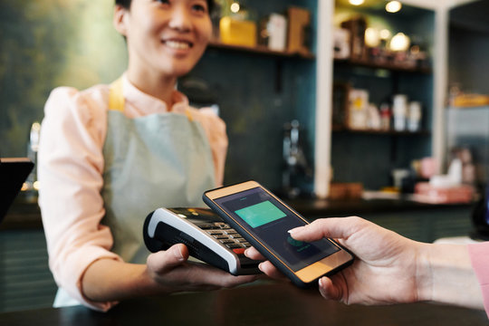 Customer paying with smartphone