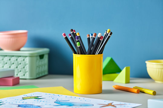 A Cup Of Crayons For Kids On Desk.