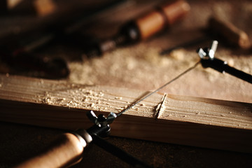 Scroll saw cutting wood