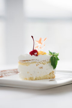 Fruit cake on white plate