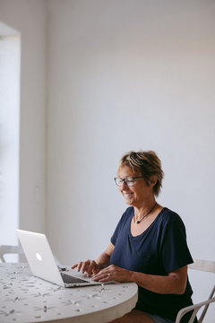 Woman using laptop at table