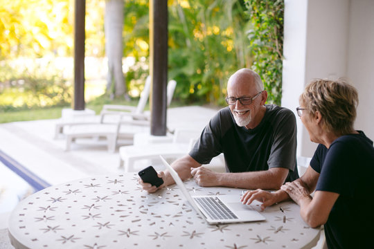 Couple using technolgy at home