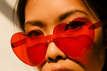 Woman in heart shape glasses