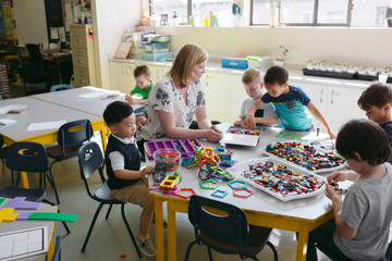Teacher interacting with students in classroom