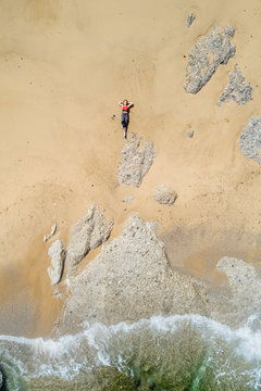 Woman lying on a beach