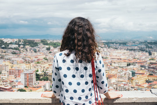 Woman looking at the city of Naples from Castle Saint Elmo