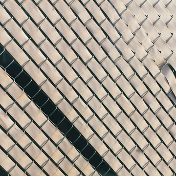 Detail of worn chain-link fence