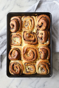Baking tray full of fresh homemade cinnamon rolls