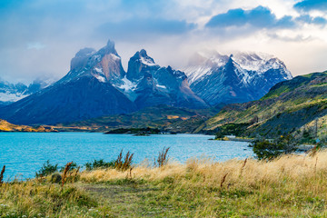 Fototapeta premium Beautiful foggy Cuernos del Paine Mountain in the evening