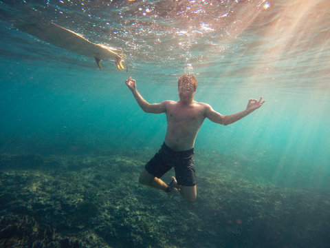 Underwater yoga pose