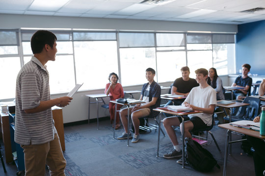 Highschool student giving presentation during class