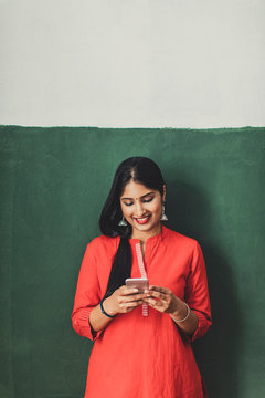 Young Woman Holding Smartphone