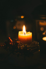 One candle on a black background, a mourning candle