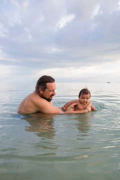 A Father and Baby Swimming