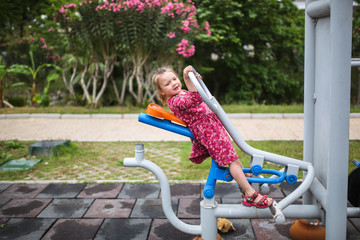 Outdoor exercise equipment, funny girl child play