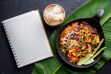Som Tam Thai - Papaya Salad Thai Food Style on wooden tabal background. Thai Food Concept. Top View
