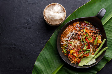 Som Tam Thai - Papaya Salad Thai Food Style on wooden tabal background. Thai Food Concept. Top View