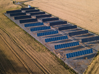 Solar Panel field with snow on panels. Photovoltaic power electrical station