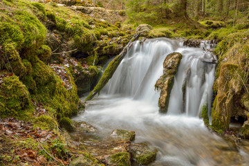 Fototapeta na wymiar Small Waterfall in autumn forest, Cheile Bicazului, Romania