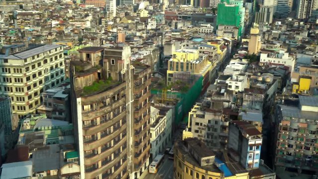 Macau China, Mix of Colonial and Modern Architecture in City Downtown. Grand Lisboa Skyscraper in Background, Tilt Up Shot