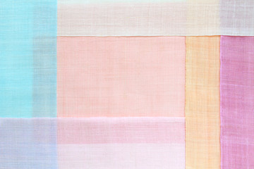 Traditional patchwork background of ramie fabric. Pastel tone.