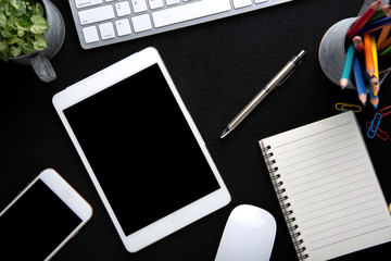 Desk workspace . Business Objects in the office on black table background