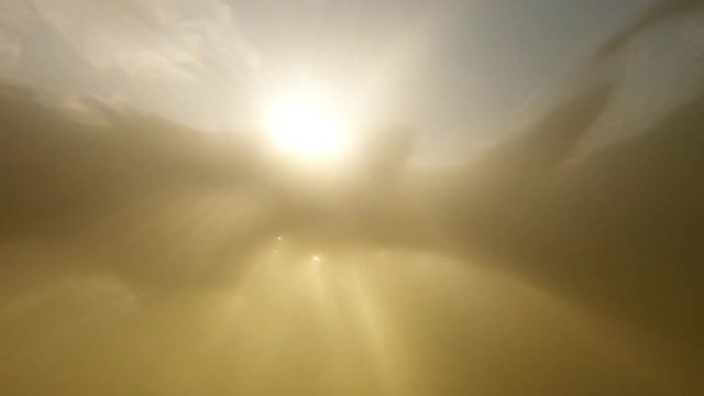 Slow Motion Underwater Looking Up.