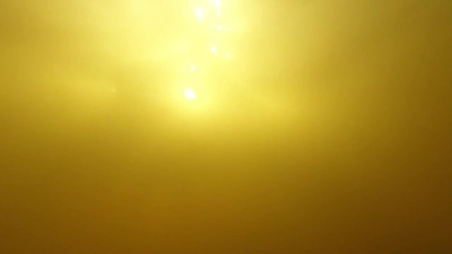Bright Sun Light From River Underwater. Slow Motion