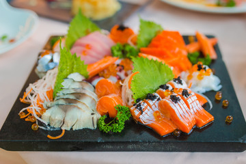 Sashimi Salmon Tuna Hamachi Prawn and Surf Calm set, raw fish, japanese food in Asian restaurant.