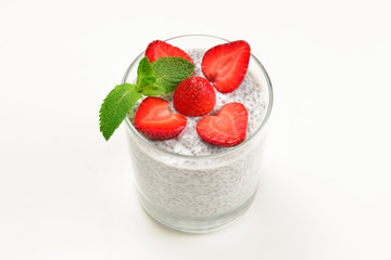 Chia pudding with strawberry and mint on a white background. Space for text or design.