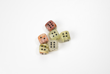 Dices made of natural stone on a white background. Copy space. Gaming.