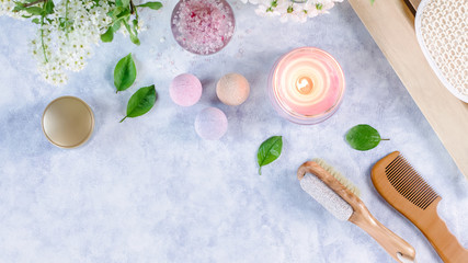 Spa and bath accessories with bath salts and beauty treatment products on wooden table. Wellness concept