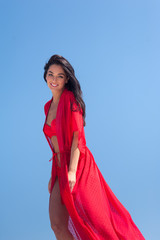 Summer Fashion. Sexy European Woman In Red Swimsuit On Beach