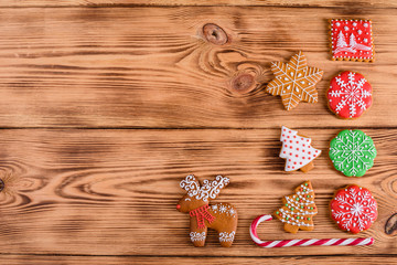 Christmas homemade gingerbread cookies on wooden table. It can be used as a background
